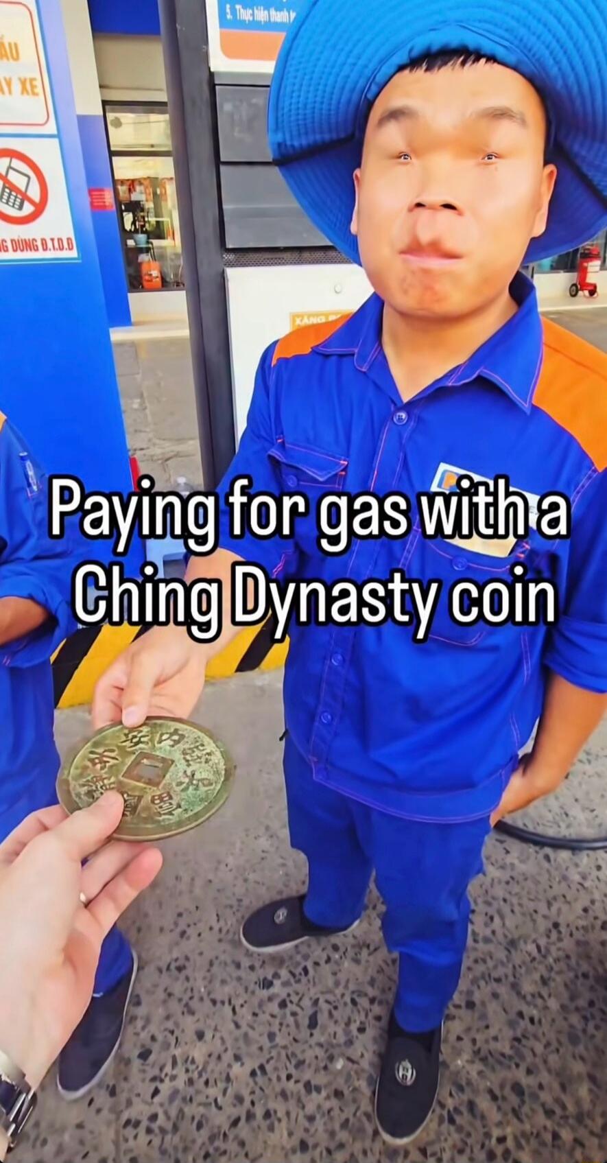 Paying for gas with a Ching Dynasty coin