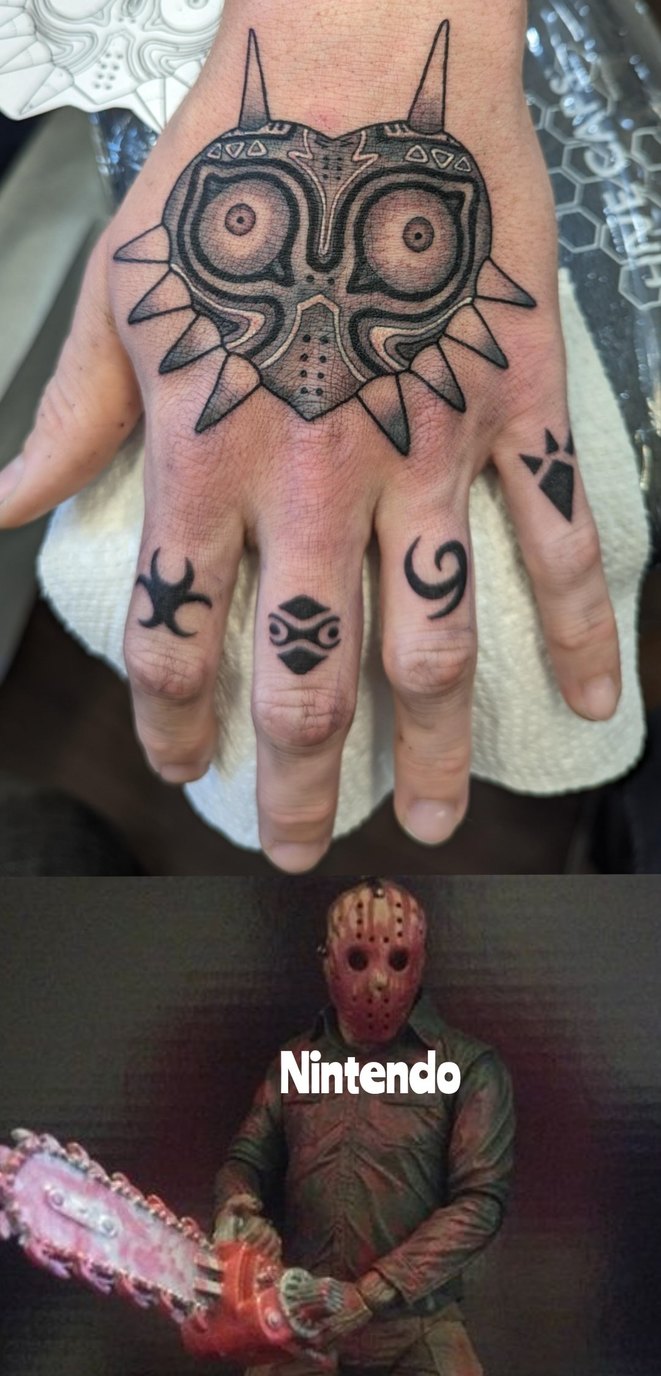 Majora's Mask tattoo on the hand with additional small finger tattoos (various symbolic shapes). Below is a meme image of Jason Voorhees from Friday the 13th with the word 'Nintendo'.