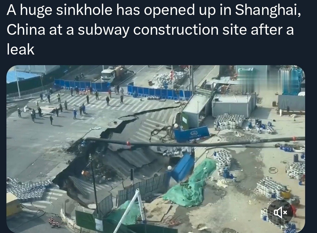 A huge sinkhole has opened up in Shanghai, China at a subway construction site after a leak
