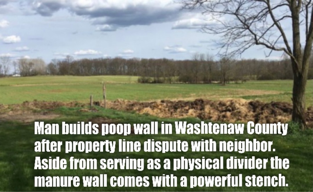 Man builds poop wall in Washtenaw County after property line dispute with neighbor. Aside from serving as a physical divider the manure wall comes with a powerful stench.