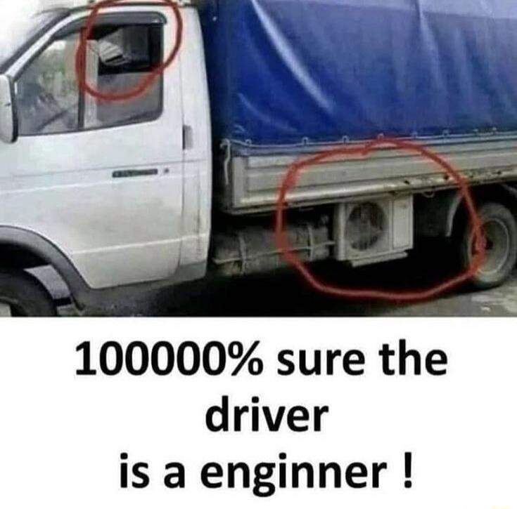 1000000% sure the driver is a enginner ! A truck driver has installed a window air conditioner unit in the cabin window and the outdoor unit under the truck bed, creating a makeshift cooling system.