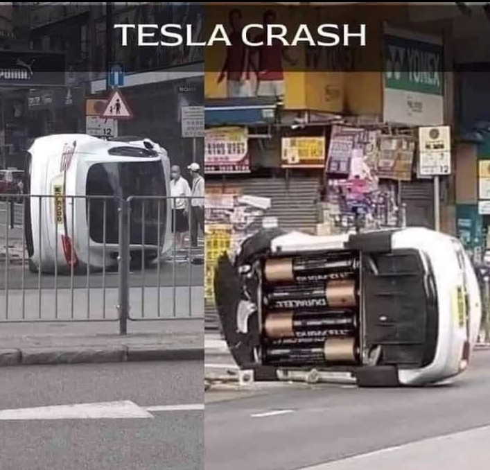 TESLA CRASH. The image shows a split screen. On the left, an overturned white car is lying on its side on a street. On the right, the same overturned car is shown from underneath, revealing several large Duracell batteries arranged in its chassis, humorously implying it's a 'Tesla crash' powered by conventional batteries.