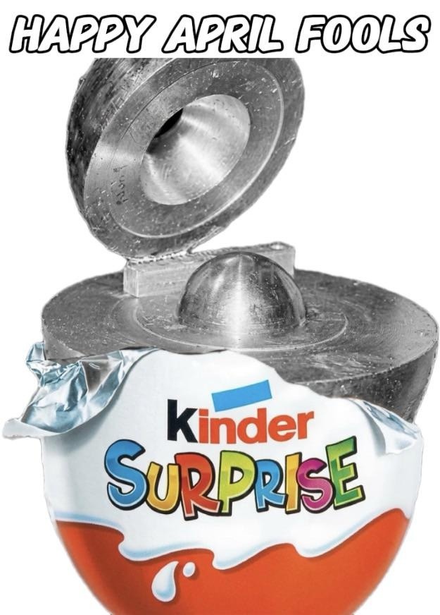 HAPPY APRIL FOOLS Kinder SURPRISE. A Kinder Surprise egg wrapper containing a heavy metal object instead of the usual chocolate and toy.
