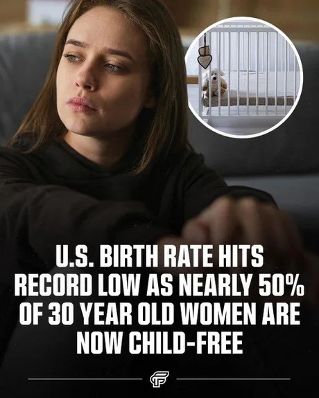 U.S. birth rate hits record low as nearly 50% of 30 year old women are now child-free. The image shows a thoughtful woman looking away, with a small circular inset showing an empty baby crib with a teddy bear inside.