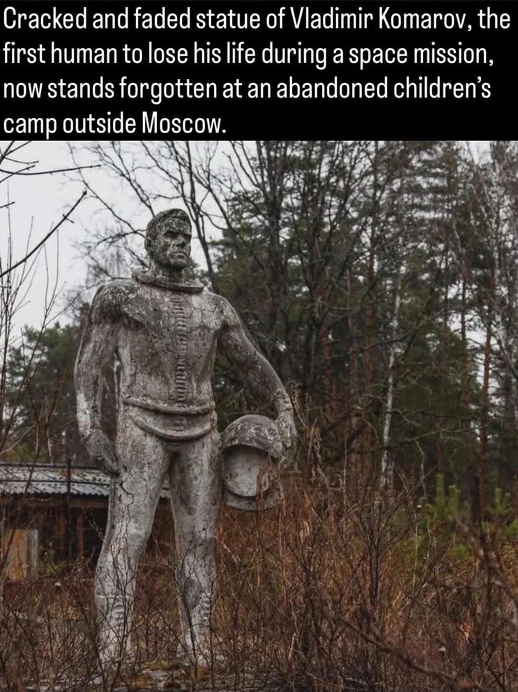 Cracked and faded statue of Vladimir Komarov, the first human to lose his life during a space mission, now stands forgotten at an abandoned children's camp outside Moscow.