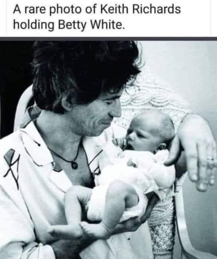 A rare photo of Keith Richards holding Betty White.