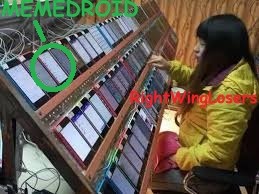 MEMEDROID RightWingLosers. A person is operating a large number of smartphones arranged on a rack, likely for social media manipulation or a 'click farm' operation.