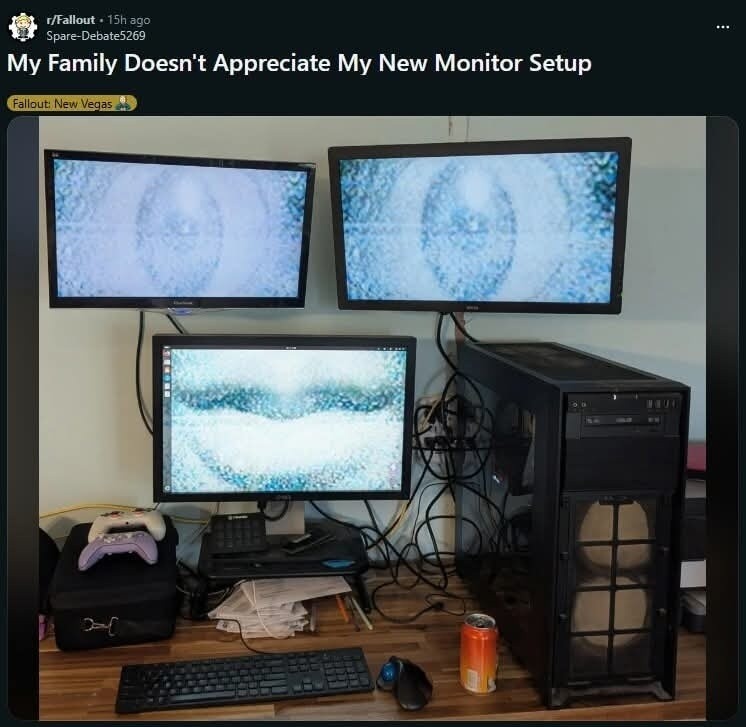 My Family Doesn't Appreciate My New Monitor Setup. Fallout: New Vegas. The monitors display a distorted, pixelated image resembling eyes or a face.