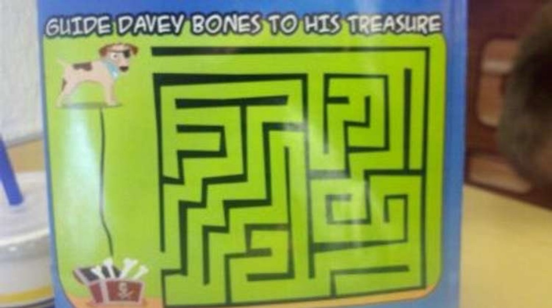 GUIDE DAVEY BONES TO HIS TREASURE. A maze for a pirate dog named Davey Bones, but the path is already drawn directly to the treasure chest, making the maze pointless.