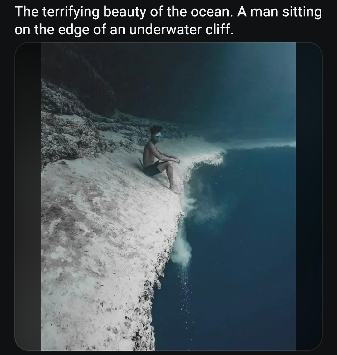 The terrifying beauty of the ocean. A man sitting on the edge of an underwater cliff.