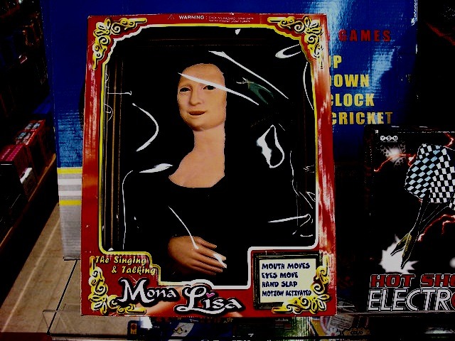 WARNING. THE Singing & Talking Mona Lisa. MOUTH MOVES, EYES MOVE, HAND SLAP, MOTION ACTIVATED. GAMES. DOWN. CLOCK. CRICKET. HOT SHOT ELECTRONIC.