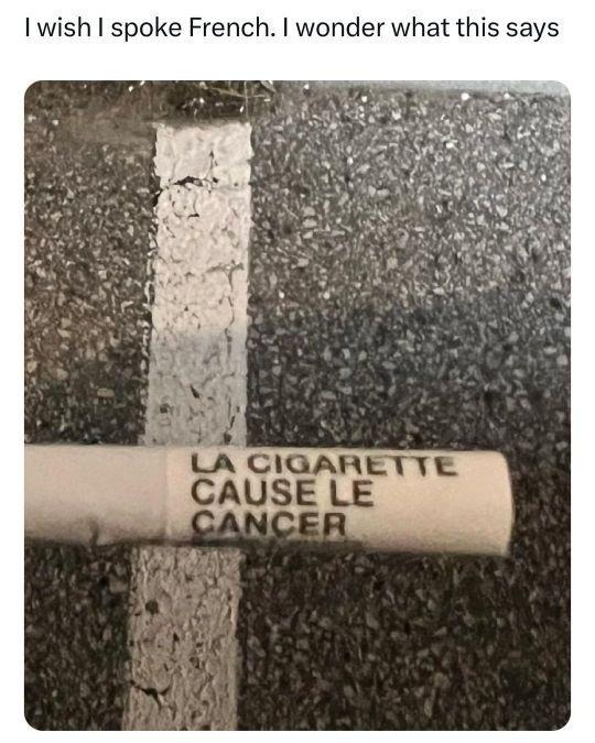 I wish I spoke French. I wonder what this says. The cigarette causes cancer.