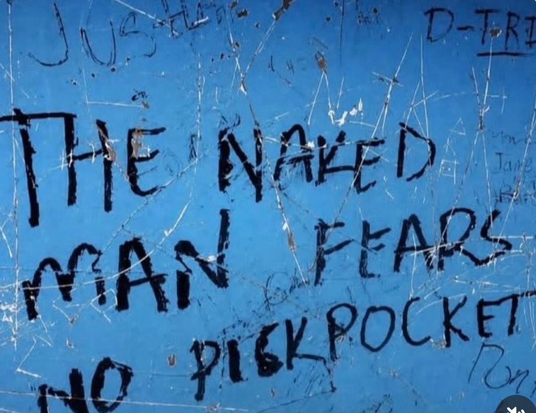THE NAKED MAN FEARS NO PICKPOCKET. Other faint text includes 'JUSTICE', 'D-TRI', 'Jane', 'Ron'.