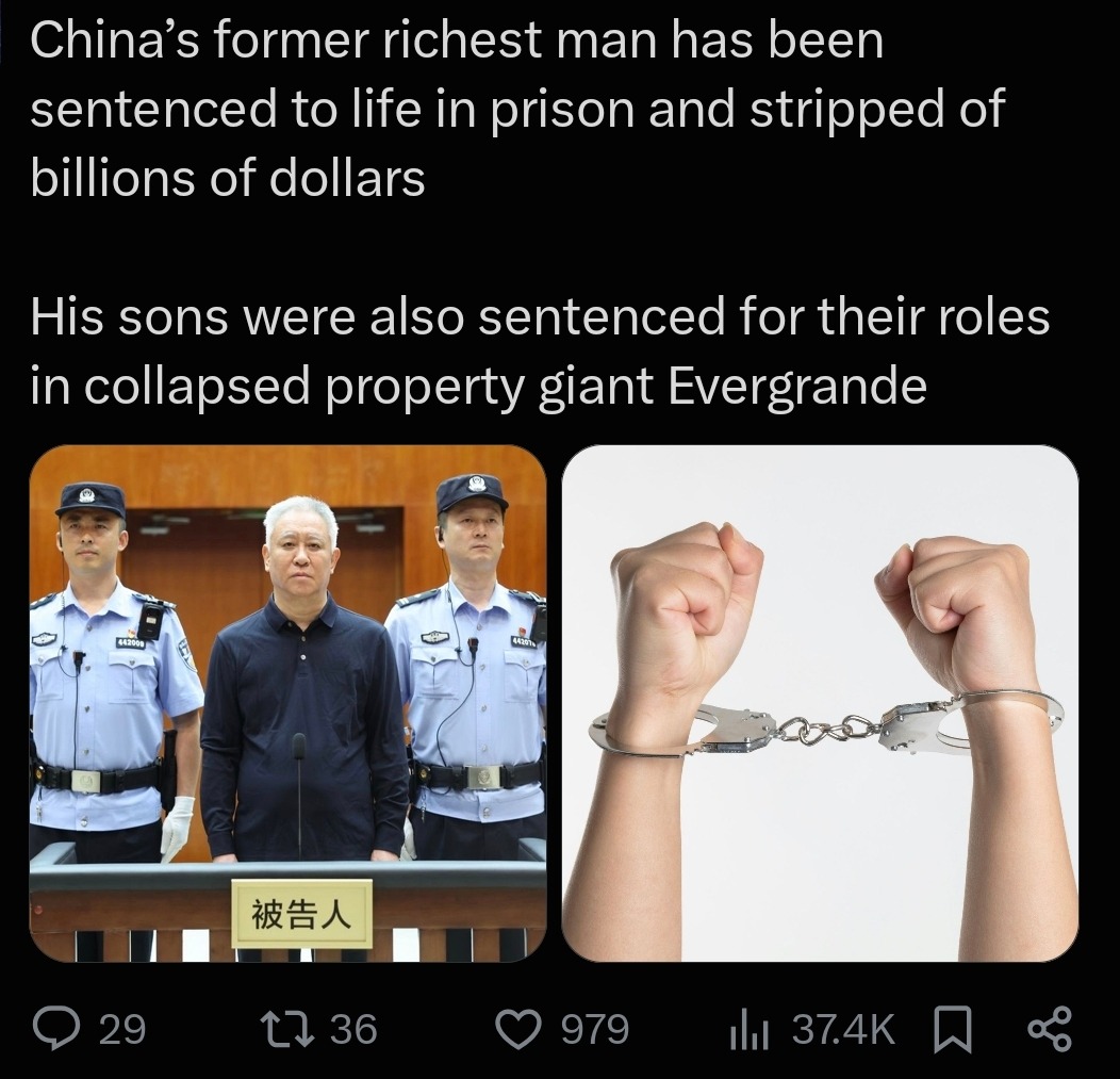 China's former richest man has been sentenced to life in prison and stripped of billions of dollars. His sons were also sentenced for their roles in collapsed property giant Evergrande. The sign reads 'Defendant'.