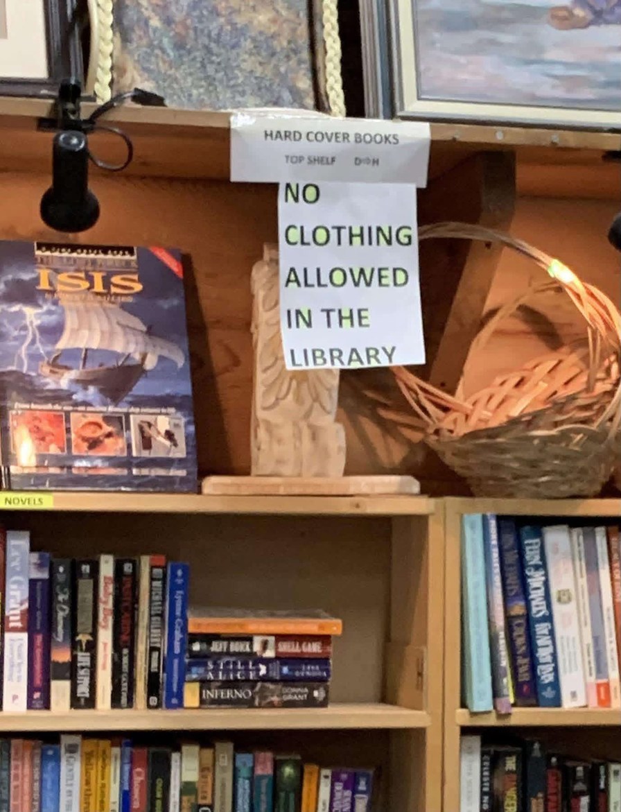 HARD COVER BOOKS TOP SHELF D H NO CLOTHING ALLOWED IN THE LIBRARY