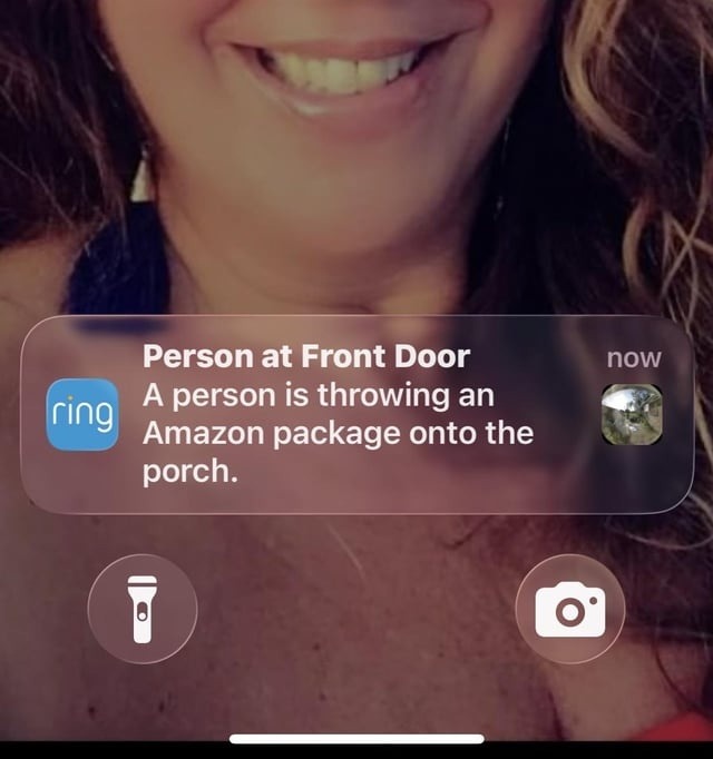 Person at Front Door now A person is throwing an Amazon package onto the porch.